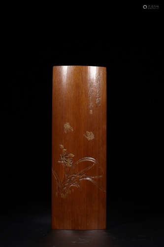 A BAMBOO  ARM REST WITH BUTTERFLY SULPTURE