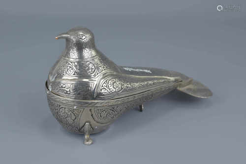 A Middle Eastern silver-plated box and cover in the form of a pigeon. 13cm x 12cm