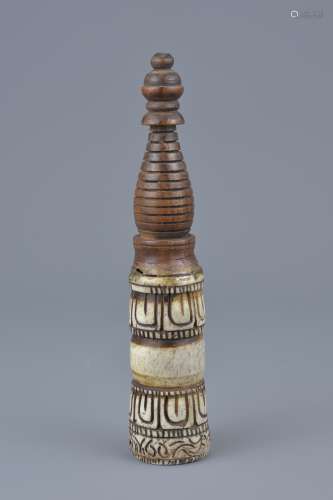 A Tibetan seal carved in wood with spiral handle. 7cm height