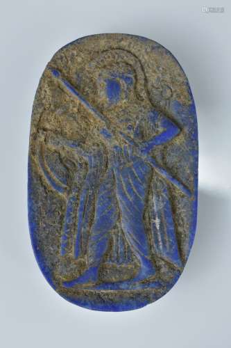 A lapis carving of a soldier with a spear. 7cm width
