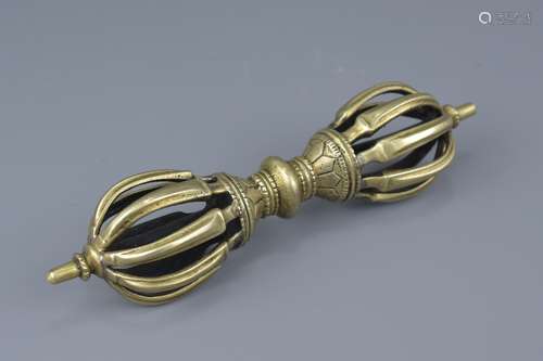 A Tibetan bronze Vajra. 20cm width