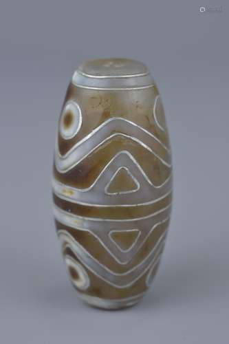 A Tibetan agate bead Tianzhu style inlaid with silver.