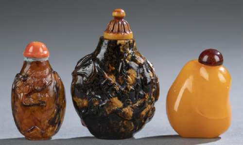 3 Amber snuff bottles.