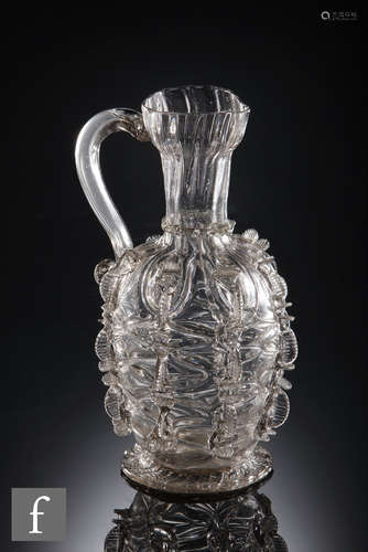 A pint serving jug with mould-blown, trailed and pincered decoration, probably England,