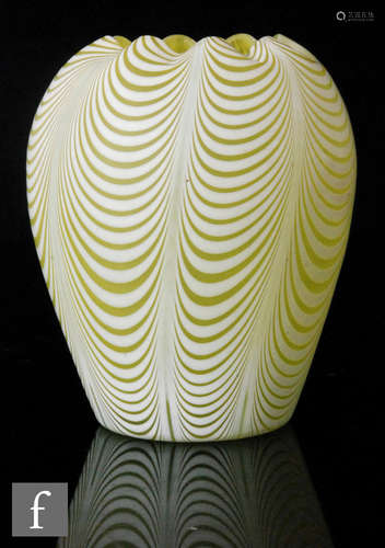 A late 19th Century vase of ovoid form in citron with white festooned trailing and crimped rim,