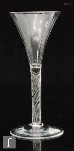 An 18th Century drinking glass circa 1755, trumpet bowl above an incised twist stem,