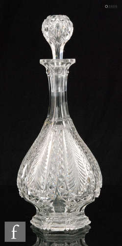 A late 19th Century Stourbridge clear crystal decanter having a sloped body with vertically cut