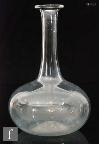 A late 18th Century serving bottle circa 1770 of plain globe and shaft form with an everted collar