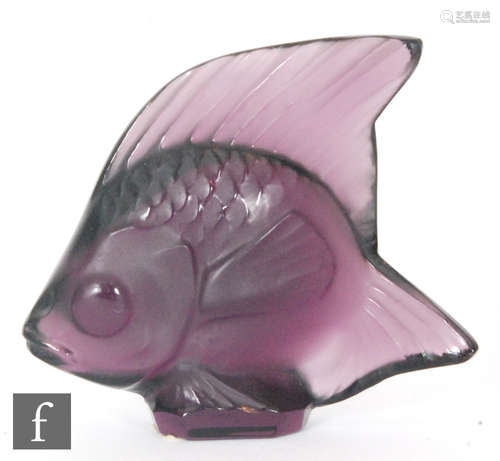 A Lalique glass fish sculpture in purple, engraved signature, height 4.5cm.