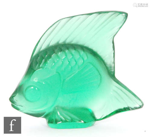 A Lalique glass fish sculpture in emerald green, engraved signature, height 4.5cm.