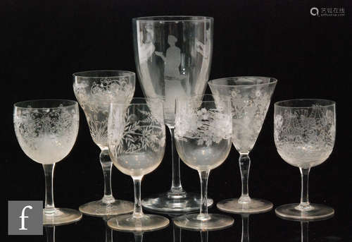 A collection of seven items of stemware with engraved decoration,