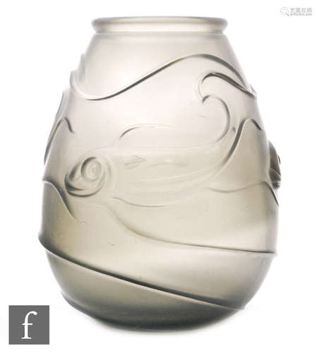 A 1930s glass vase of tapering form with moulded stylised fish decoration in the style of Lorraine,