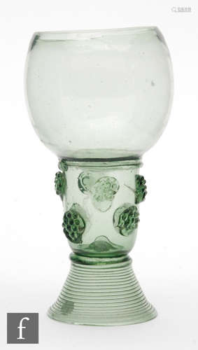 A late 17th Century European Roemer drinking glass with an ovoid form above an integral stem with