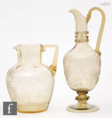 A large late 19th Century continental ewer of footed ovoid form with collar neck and high loop