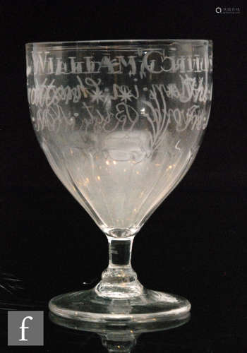 A late 18th Century drinking glass with a tapered ovoid bowl with basal petal moulding,