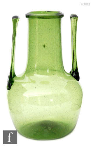 A large late 19th Century green glass vase in the manner of Dr Christopher Dresser for Clutha,