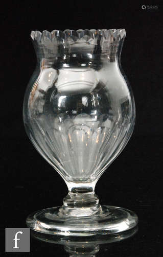 A late 17th Century glass vase circa 1800 of tulip form with a cut petal edged rim and basal slice