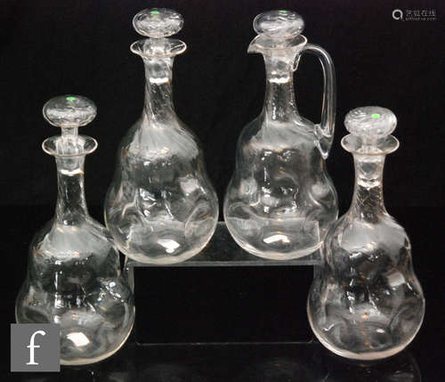 A set of three decanters in the manner of James Powell & Sons,