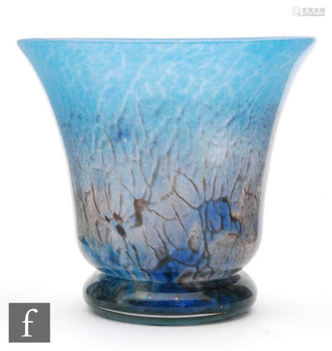 A Monart glass vase, the footed vase extending to a flared rim with stippled purple,