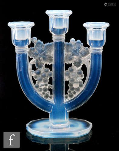 A 1930s Art Deco Barolac three light candlestick with grape and vine motifs uniting the branches