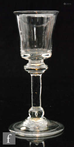 An 18th Century baluster drinking glass circa 1730,