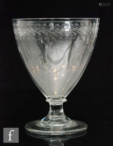 A large late 18th Century oversized Rummer with round pointed bowl engraved with an upper stylised