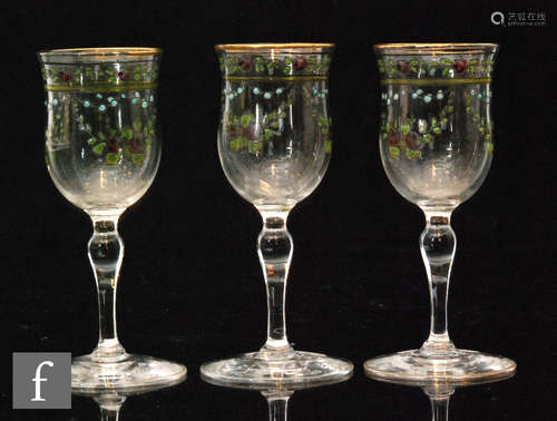 A group of three early 20th Century Webb Corbett drinking glasses with bell shaped bowls enamel