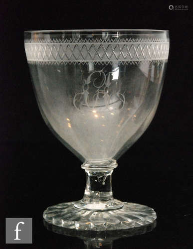 An early 19th Century oversized Rummer with an ovoid bowl with upper engraved diamond band above a