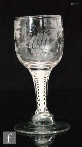 A Continental drinking glass with ovoid bowl engraved with fruiting vine and open winged bird verso