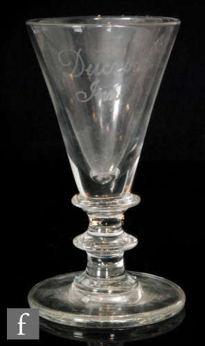 An early 19th Century goblet with a large conical bowl above a bladed knop with waisted stem and