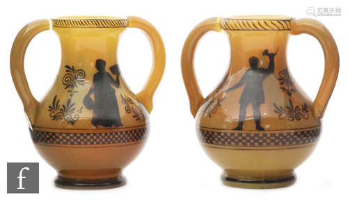 A pair of mid 19th Century caramel vases of footed ovoid form with slender neck and applied loop