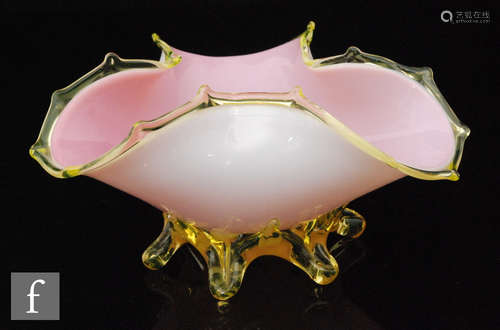 A late 19th Century Stourbridge glass posy bowl of tri-form cased in opal over pink and decorated