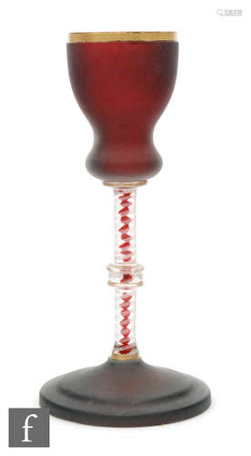 A late 19th Century goblet with a ruby double gourd form bowl with frosted finish above a colour