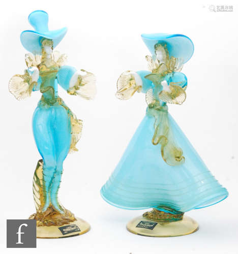 A pair of 20th Century Venetian Glass Company figures of a lady and her beau in elaborate dress,