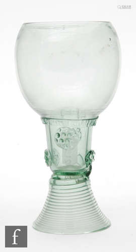 A late 17th Century European Roemer drinking glass with an ovoid form above an integral stem with