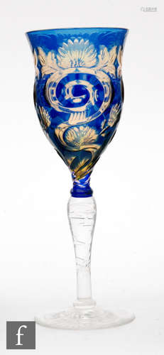 An early 20th Century Stevens & Williams double colour cased wine glass having a slender ogee form