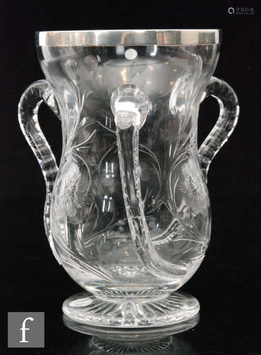 An early 20th Century Stevens & Williams clear crystal tyg of footed waisted form with three