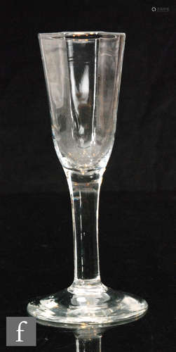 An 18th Century ale glass circa 1750, hexagonal moulded bowl above a plain solid stem,