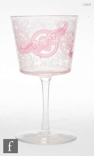 A late 19th Century wine glass with a bucket form bowl cased in clear crystal over pink and