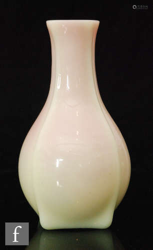 A 19th Century Burmese vase of footed ovoid form with collar neck, cased in opal over pink,