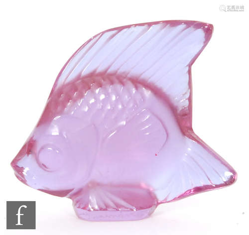 A Lalique glass fish sculpture in fuchsia, engraved signature, height 4.5cm.