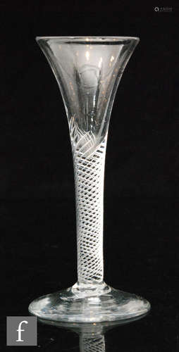 An 18th Century drinking glass circa 1750, drawn trumpet bowl above a multi series air twist stem,