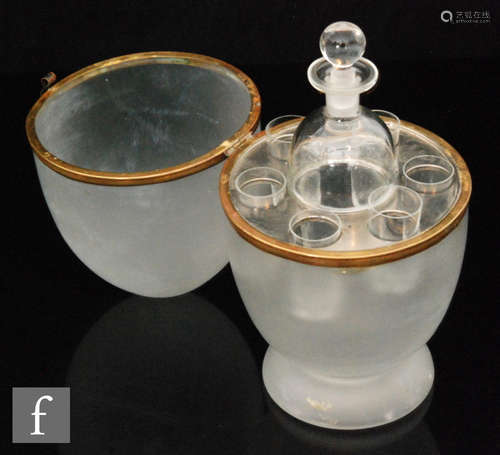 A late 19th Century French crystal glass drinks case of ovoid form with a frosted finish and gilt