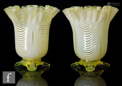 A pair of late 19th Century vases of ovoid form with crimped rim in citron with applied white