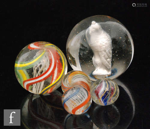 A collection of five late Victorian to Edwardian marbles,