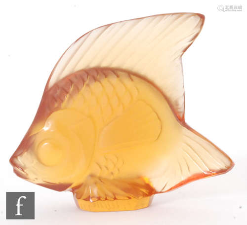 A Lalique glass fish sculpture in amber, engraved signature, height 4.5cm.