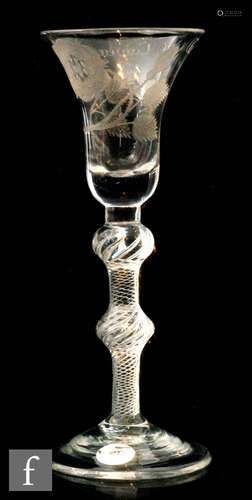 An 18th Century Jacobite drinking glass circa 1750, the bell bowl engraved with an open rose,