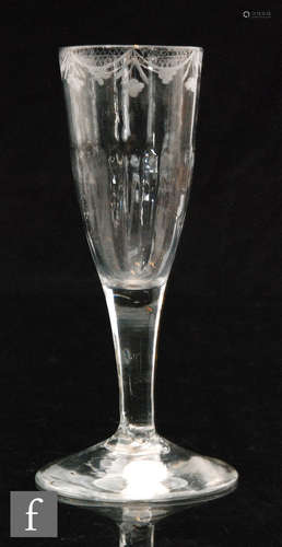 An 18th Century Ale glass circa 1760 two piece drawn bowl with upper engraved swagged border above