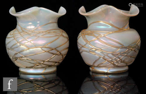 A pair of early 20th Century Kralik glass posy vases of shouldered ovoid form with quatrelobed rims