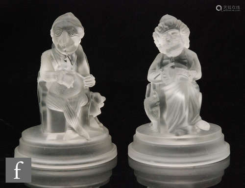 A pair of late 19th Century novelty Mr Punch & Judy figures by John Derbyshire, both figures seated,